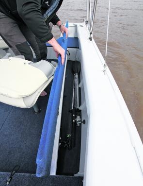 Along the left hand side of the deck there is a full length rod storage compartment.