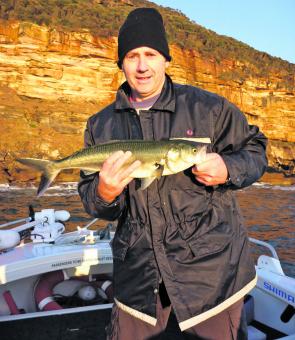 Be sure to rug up if leaving early. Greg displays a salmon caught trolling the washes first thing in the morning.
