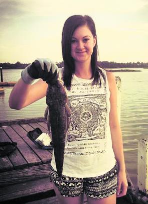 Chloe Jones with a flathead caught at the Lake Tyers boat ramp.