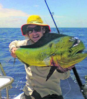 Chris Cahill with a beautifully coloured mahi mahi. Find floating structure in warm current and you will likely encounter these colourful acrobats. 