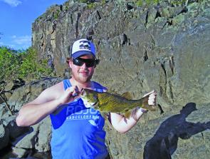 Brad Didner with a Paterson river bass caught on a blade.
