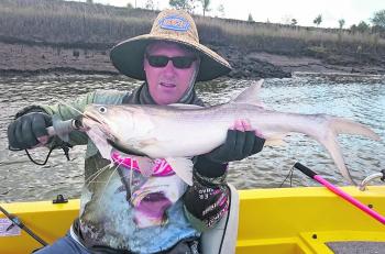 Brett Newman with a Fitzroy king threadfin salmon, which have been biting like crazy in recent months.