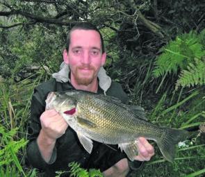 Ross Noakes with a shore-based bass approaching the magic 50cm mark. 