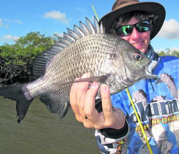 Jacko with a nice pikey bream taken while hiding up a creek from southerly winds.