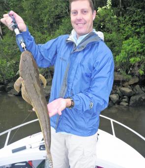 Brett Penprase caught this 68cm flathead in less than ideal conditions at Wisemans Ferry. He released it to fight another day.