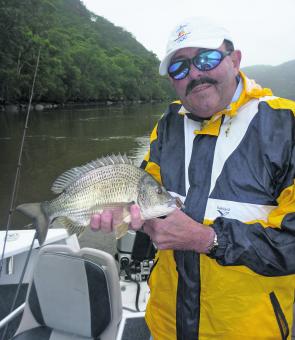 Peter Penprase with a healthy dirty-water bream caught on a soft plastic grub.