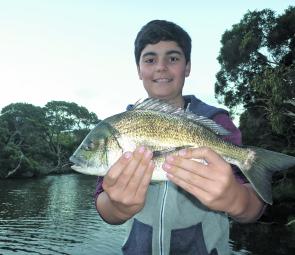 Mitch Albrecht proudly holds up his PB bream prior to release.
