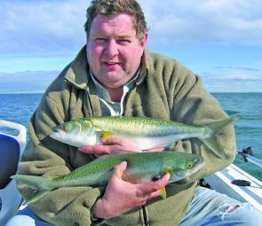 Simon Ellis with an armful of salmon from Canadian Bay