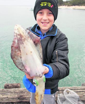 Luke Marchetti with a lovely 1kg squid taken at Portsea Pier.
