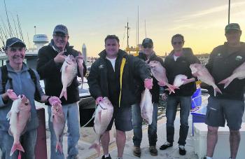 Happy customers in Wyndham Harbour after a trip aboard Two Up Fishing Charters with Tony Spiteri.