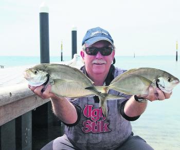 The author with a couple of silver trevally caught while berleying wide off Towra Point.