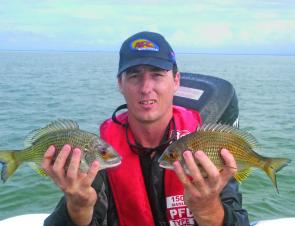 Jason with his fist’s full of healthy bream from the flats.