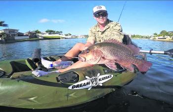 Justin Peacock with another jack from the canals.