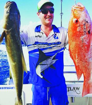Keith Ohara with his hands full – looks like cobia and nannygai for dinner.