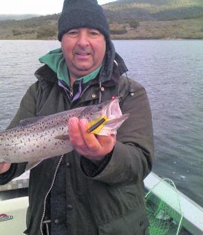 Fernando Pontes with a good winter brown caught on a Steve Williamson special black yellowing Tasmanian Devil lure.