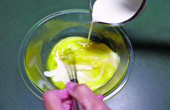 In a separate bowl, crack all six of the eggs and whisk lightly. Combine the cream with the eggs and whisk until they are thoroughly combined.