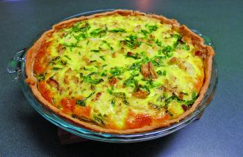 Cool the cooked quiche slightly for about five minutes to allow it to firm. Cut it into wedges before serving. 