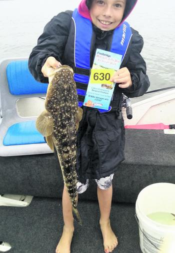 Conner Talbot was stoked to catch his 67cm fish while fishing with his Pa Barry Smith.