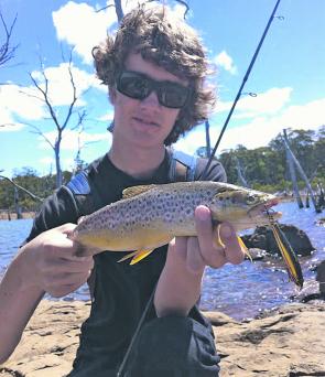 Nathan Huizing with a chunky Lake Echo brown trout.