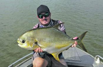 Scott Gorman with a 90cm Weipa permit caught on the Mission River with a Threadybuster!