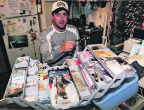 Luke Credlin packs his fly tying gear into a new canine-proof box after his large dog ate $300 worth of fly-tying material.