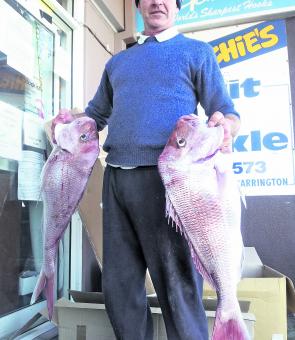 Bill Gibson with a pair of reds of 5.5kg and 6kg caught away from the leatherjacket schools.