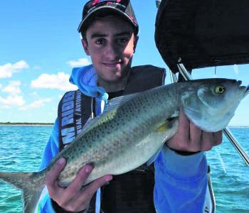Jason Tanti with the ‘torpedo of the bay’ – Australian salmon.