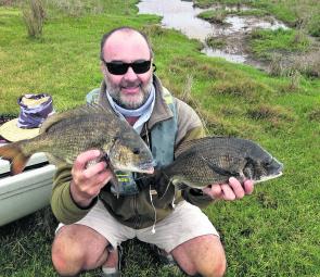 Chris Burbidge with two big Gippy Lakes bream. You can expect to find these sorts of fish feeding in the shallows over the next month. 