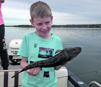 This angler is pleased with his first fish caught on a lure. Who wouldn’t be?