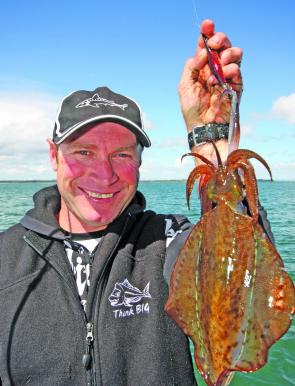 Gawaine Blake displays a solid calamari taken from the Middle Spit on an artificial jig.