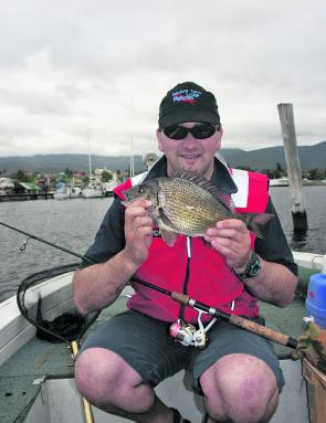 Craig Templar with a solid Derwent River bream taken on one of his unique fly-jigs.