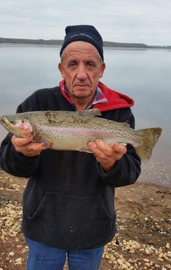 John Rivett with a gorgeous rainbow trout caught on a recent Maryborough Angling Club fishing day at Tullaroop Reservoir. (Photo courtesy of John Rivett)
