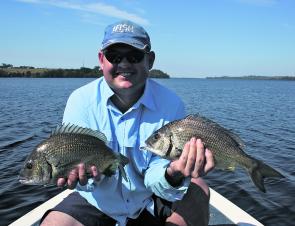 Peter Steward with a couple of solid black bream caught on plastics. In all, 21 bream were caught and released that morning.
