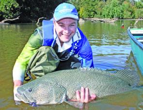Ashley Barber proudly displays the 112cm Murray cod he caught and released in the Murrumbidgee River with the author last cod season. Big ’Bidgee cod like this will be keen to feed after their spawning run.