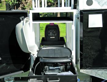 Strong slides allow items such as a Weber and generator to be easily accessed from this big compartment. Note the shelf up top for poles and other items. 