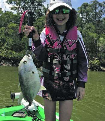 The author’s daughter Amity with a nice trevally. Christmas is a great time to take the kids fishing.