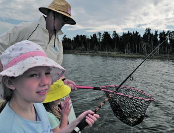 Holidays, kids fishing and a fish in the net – it doesn’t get much better.