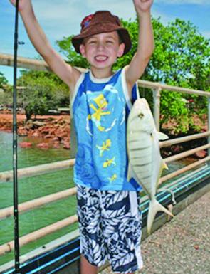 Young Cody Ward with a nice little golden trevally he landed from a jetty up in Weipa.