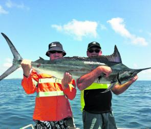 Two very happy Bowen fishermen who snared this black marlin between the first and second mackerel patch less than 10km from the ramp!