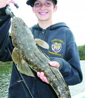 Jackson Barry with a prawn-munching Bermagui River dusky from the shallows.