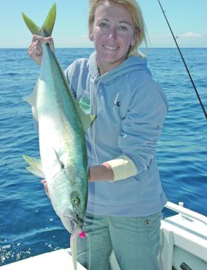 The author with a yellowtail kingfish taken from Smiths Reef on a Brisbane Sport Fish Club trip in August 2008; the lure is again a large white/pearl soft plastic shad from Lunker City. Any of the pearl or pearl belly fish scale back coloured lures seem t