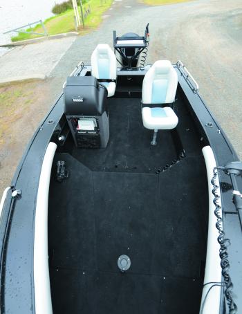 The Crossfire features a drop-in deck segment for the bow rider configuration. You can see the padding around the inside of the front gunwale that protects the back while bowriding.