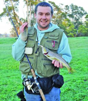 The author showing off a nice brown trout he caught early in the morning on opening day on a F5 Rapala in the Tarago River.