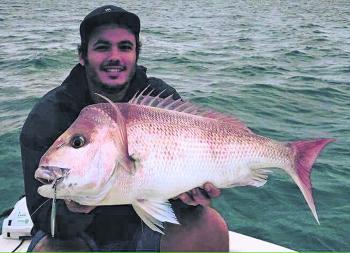 Aaron Winch with a great Moreton Bay snapper at 77cm. This fish was caught throwing a micro-jig lure at the Harry Atkinson artificial reef.