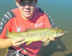 Jack Hauser with a brown trout around 47cm caught in the Dartmouth pondage working the recently submerged grass beds with an Eddy's wasp in gold chrome. Photo courtesy Jack Hauser.