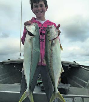 Young Billy Olver with a nice pair of kingfish caught in the bay.