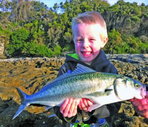 Young Lockie Davidson is stoked with his first salmon off the stones.