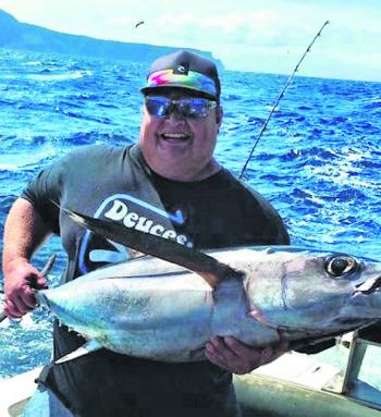 Albacore have big pectoral fins and big eyes. Mozz has a big grin as this Albacore went 22kg.