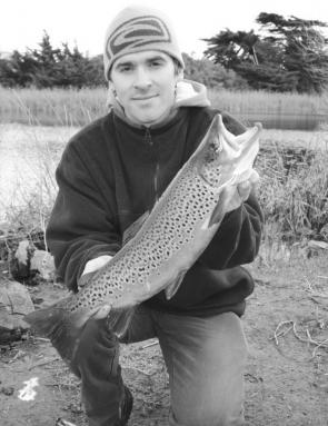 Jason Kelly with a typical Merri River brown trout.