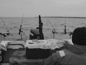 The waiting game…having your rods positioned low to the water in rod holders is the best way to hook up with ‘Big Red’ when he arrives.